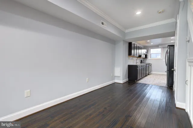 a view of a kitchen with a sink and a stove top oven