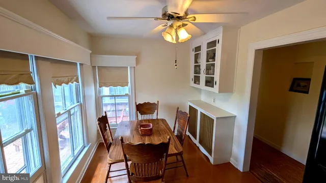 a view of a chairs and table in patio of a yard