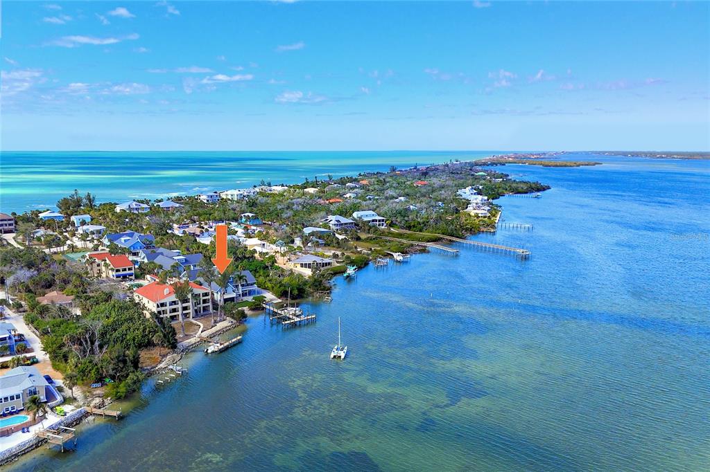 6005 North Beach Road, Unit 16 Englewood, FL 34223 - Photo 1 of 57 an aerial view of a houses with an ocean view