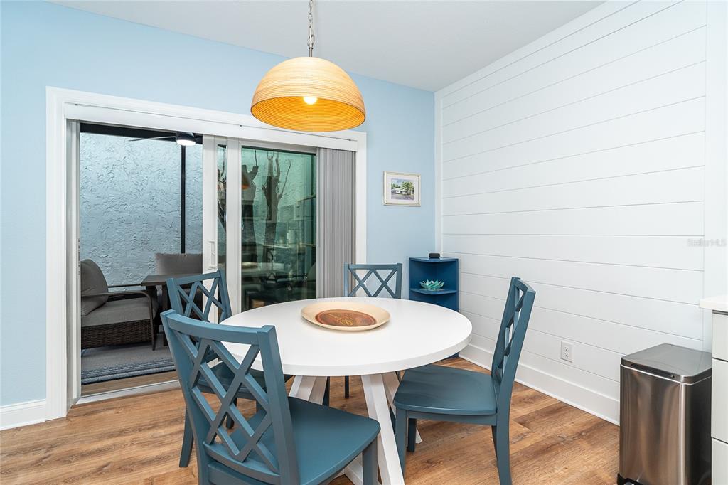 6005 North Beach Road, Unit 16 Englewood, FL 34223 - Photo 14 of 57 a view of a dining room with furniture and a window