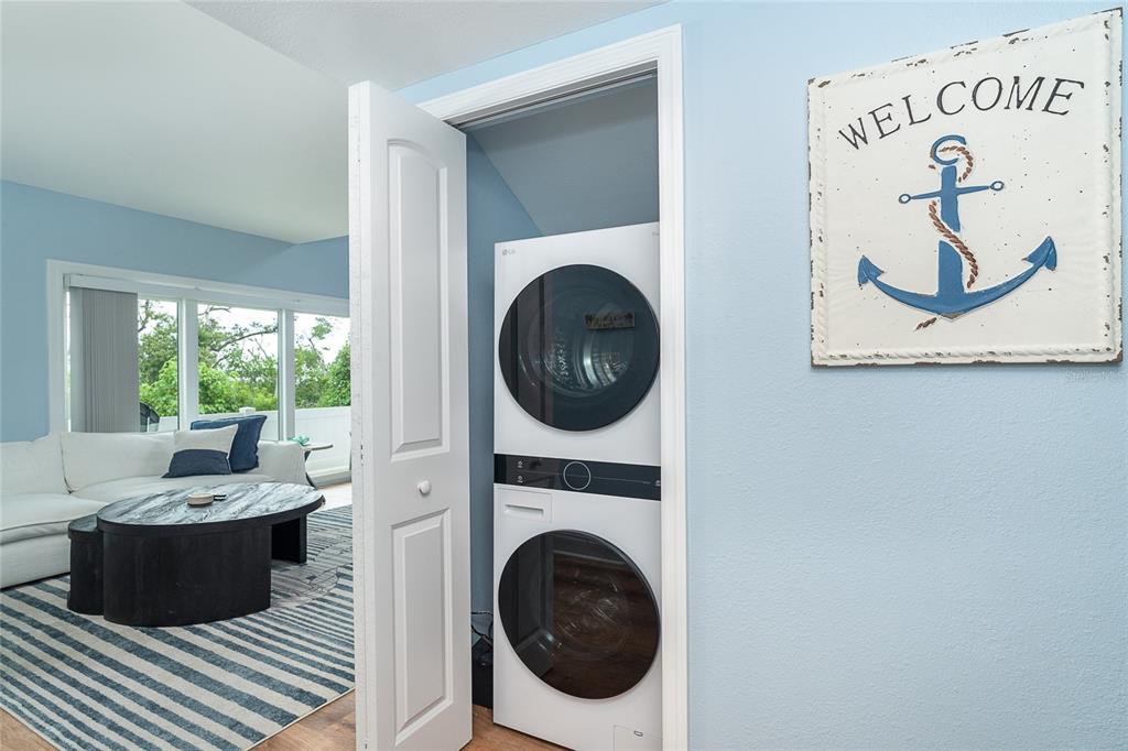 6005 North Beach Road, Unit 16 Englewood, FL 34223 - Photo 16 of 57 a view of a living room with a washer and dryer