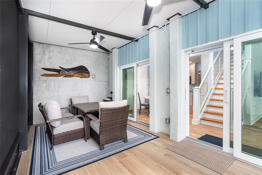 6005 North Beach Road, Unit 16 Englewood, FL 34223 - Photo 18 of 57 a dining room with furniture and a rug