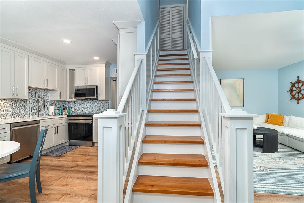 6005 North Beach Road, Unit 16 Englewood, FL 34223 - Photo 21 of 57 a view of entryway and hall with wooden floor
