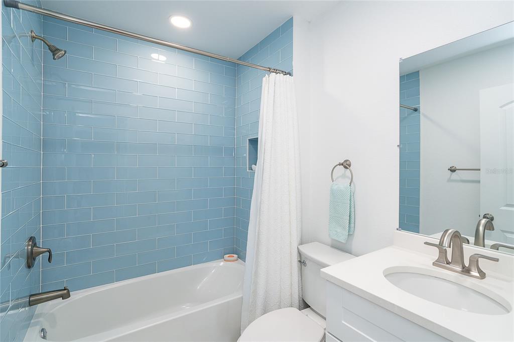 6005 North Beach Road, Unit 16 Englewood, FL 34223 - Photo 25 of 57 a bathroom with a sink toilet and shower