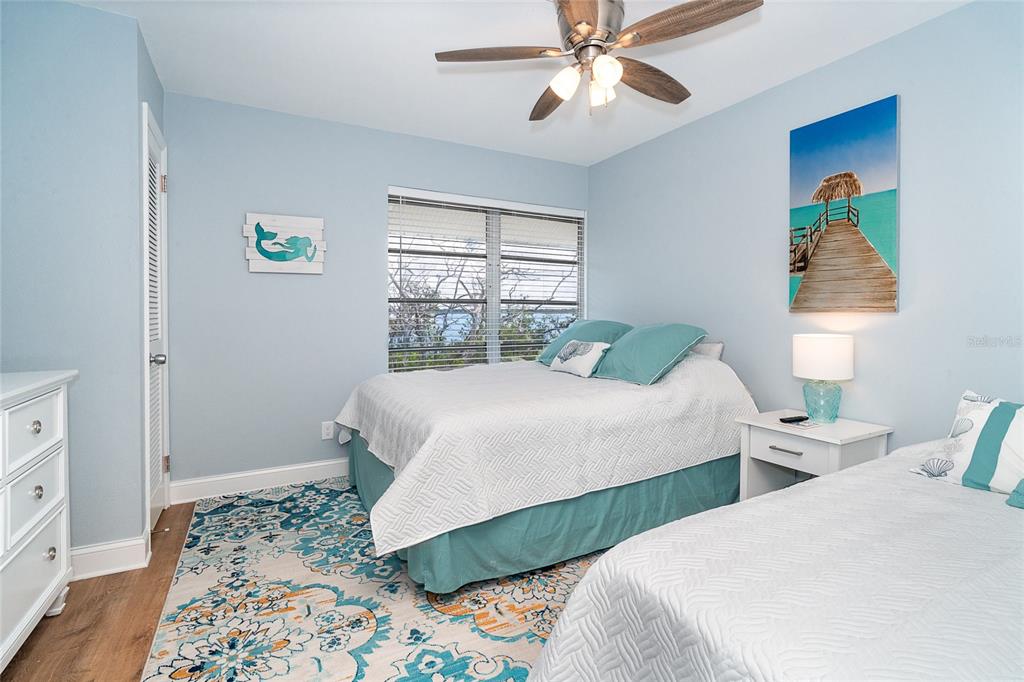 6005 North Beach Road, Unit 16 Englewood, FL 34223 - Photo 26 of 57 a bedroom with two beds and a window