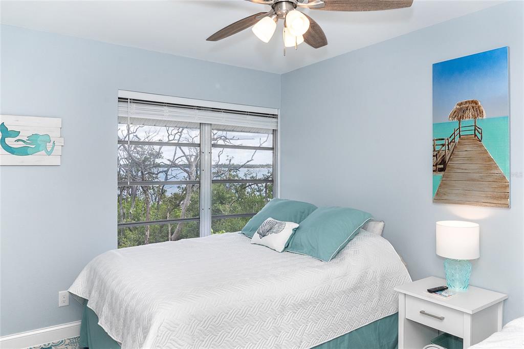 6005 North Beach Road, Unit 16 Englewood, FL 34223 - Photo 28 of 57 a bedroom with a bed and a window