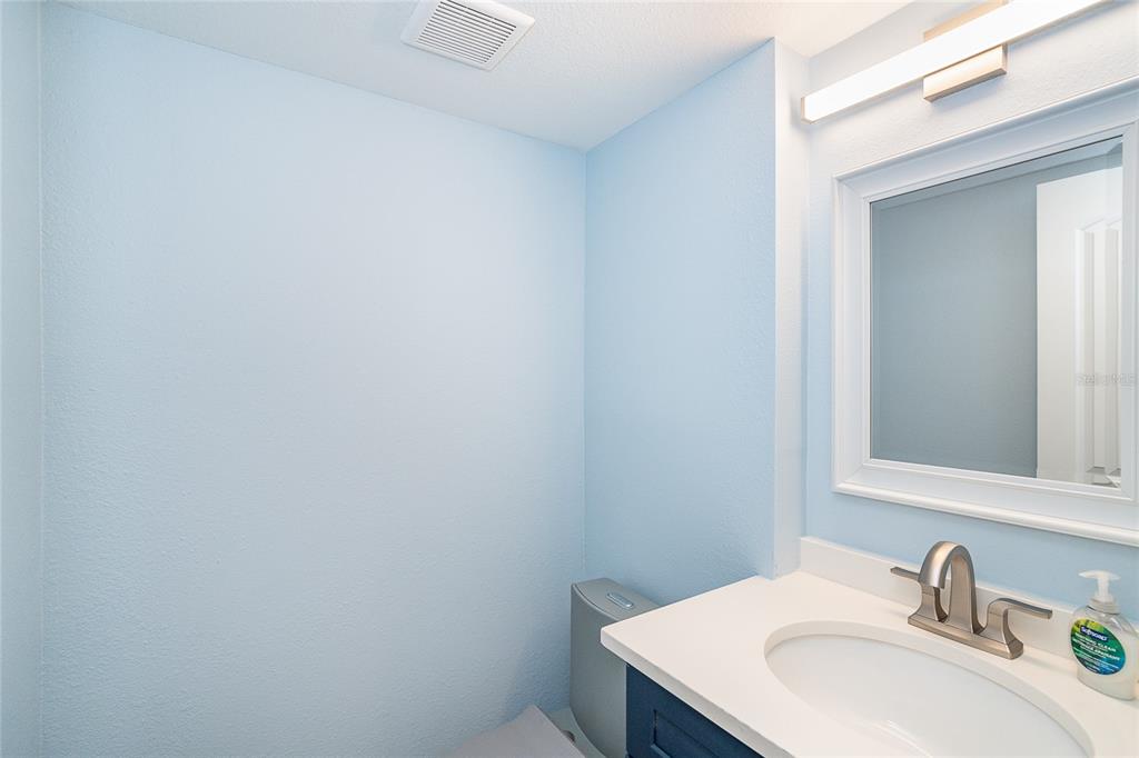 6005 North Beach Road, Unit 16 Englewood, FL 34223 - Photo 30 of 57 a bathroom with a sink vanity and a mirror