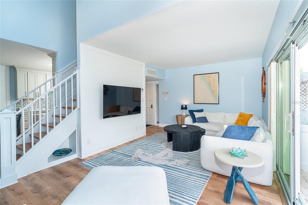6005 North Beach Road, Unit 16 Englewood, FL 34223 - Photo 3 of 57 a living room with furniture and a flat screen tv