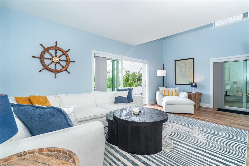 6005 North Beach Road, Unit 16 Englewood, FL 34223 - Photo 31 of 57 a living room with furniture and a large window