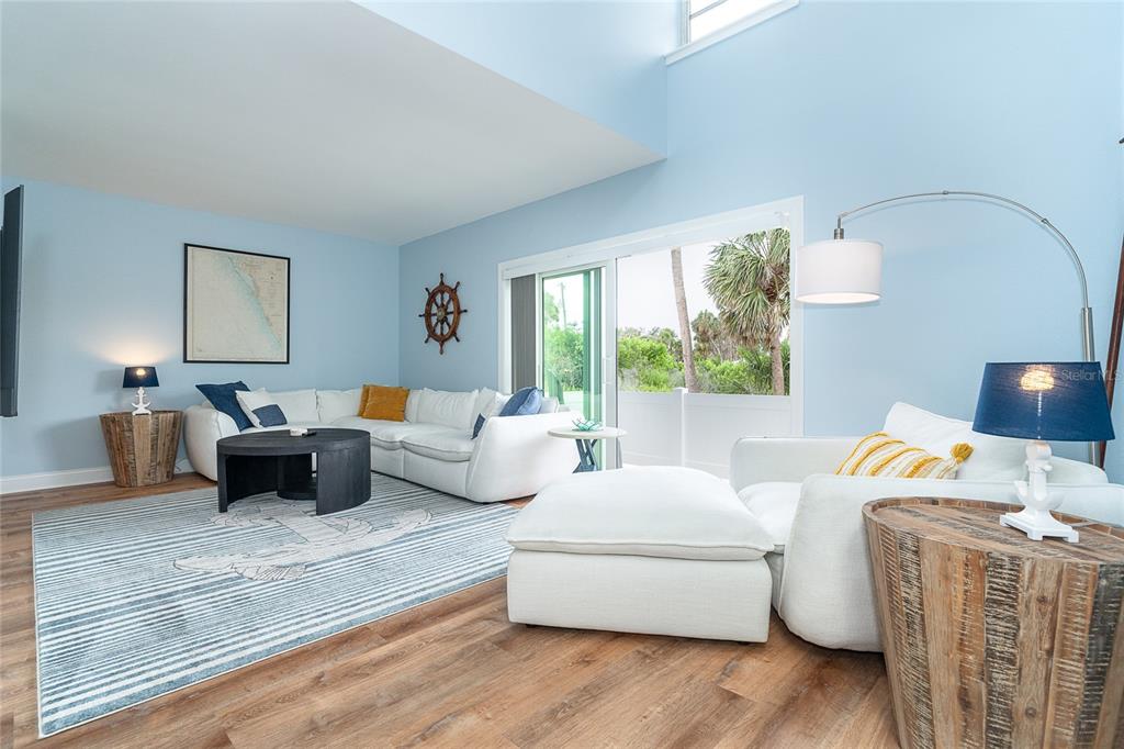 6005 North Beach Road, Unit 16 Englewood, FL 34223 - Photo 32 of 57 a bedroom with furniture and a large window