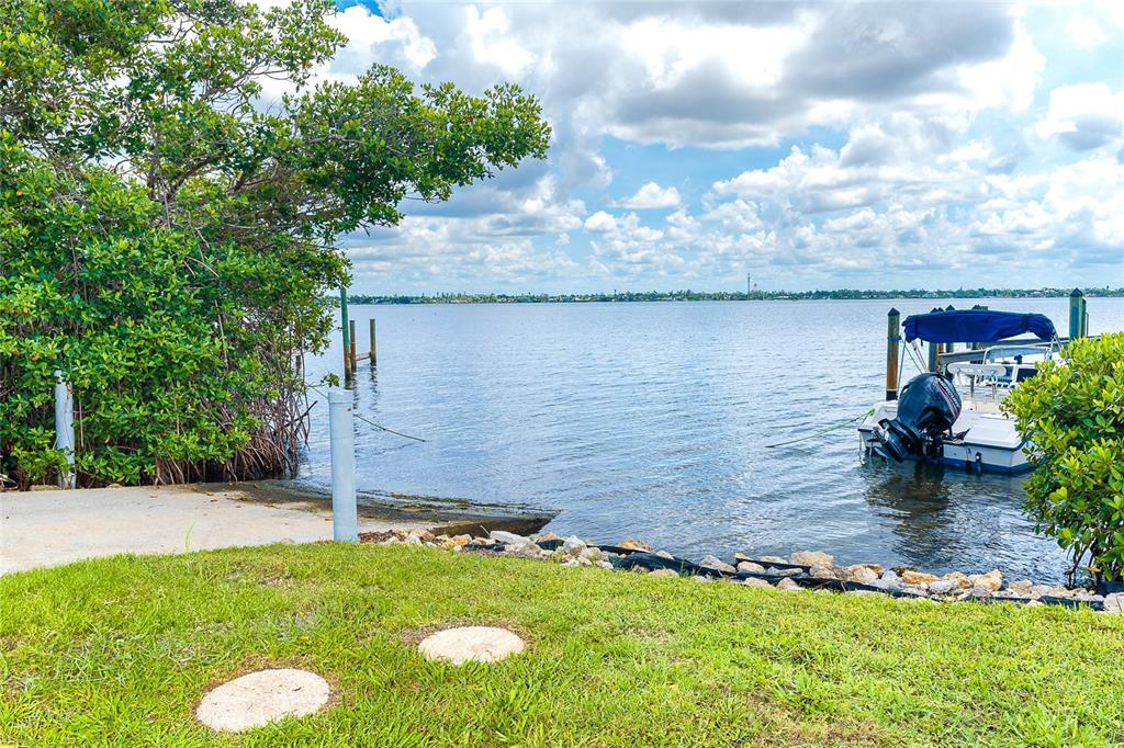 6005 North Beach Road, Unit 16 Englewood, FL 34223 - Photo 38 of 57 a view of a garden with a bench
