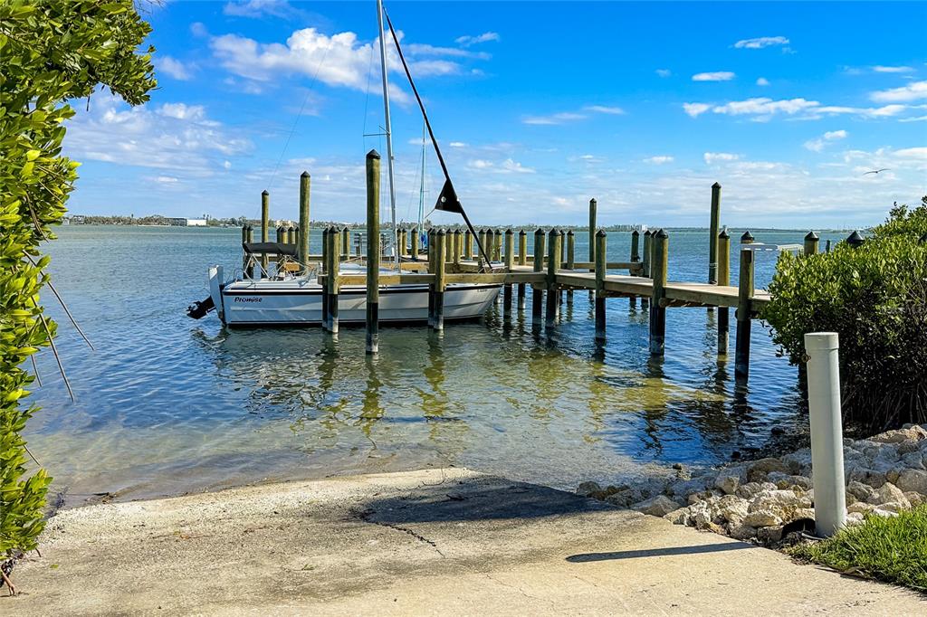 6005 North Beach Road, Unit 16 Englewood, FL 34223 - Photo 50 of 57 a view of a lake with a sitting area