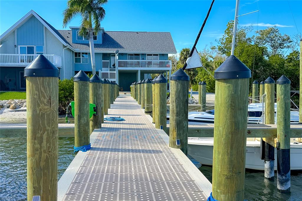 6005 North Beach Road, Unit 16 Englewood, FL 34223 - Photo 56 of 57 a front view of a house with a yard