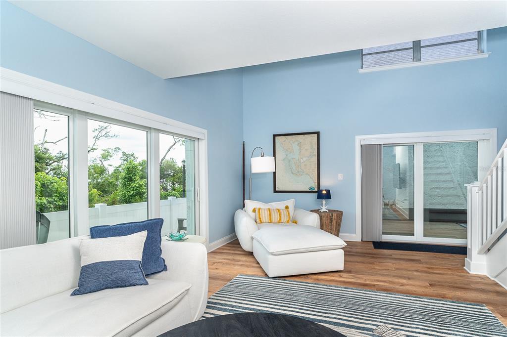 6005 North Beach Road, Unit 16 Englewood, FL 34223 - Photo 8 of 57 a living room with furniture and a large window