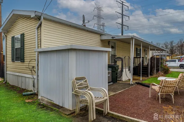 a view of a chair and tables in the patio