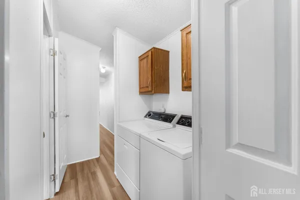 a view of bathroom with a sink and mirror
