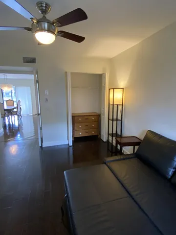 a view of room with window and wooden floor