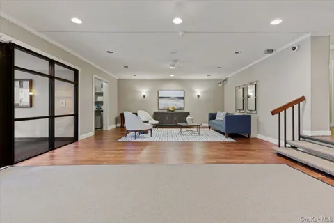 a view of room with window and wooden floor