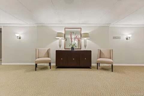 a bed room with furniture and a chandelier