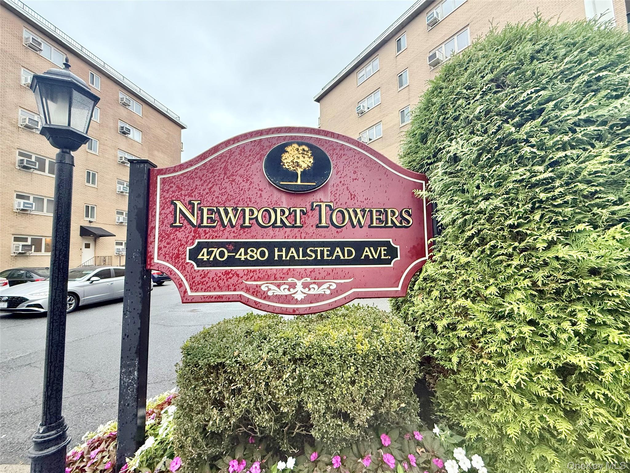 470 Halstead Avenue, Unit 5E Harrison, NY 10528 - Photo 22 of 22 a sign broad in front of flowers