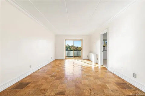 a view of an empty room with a window