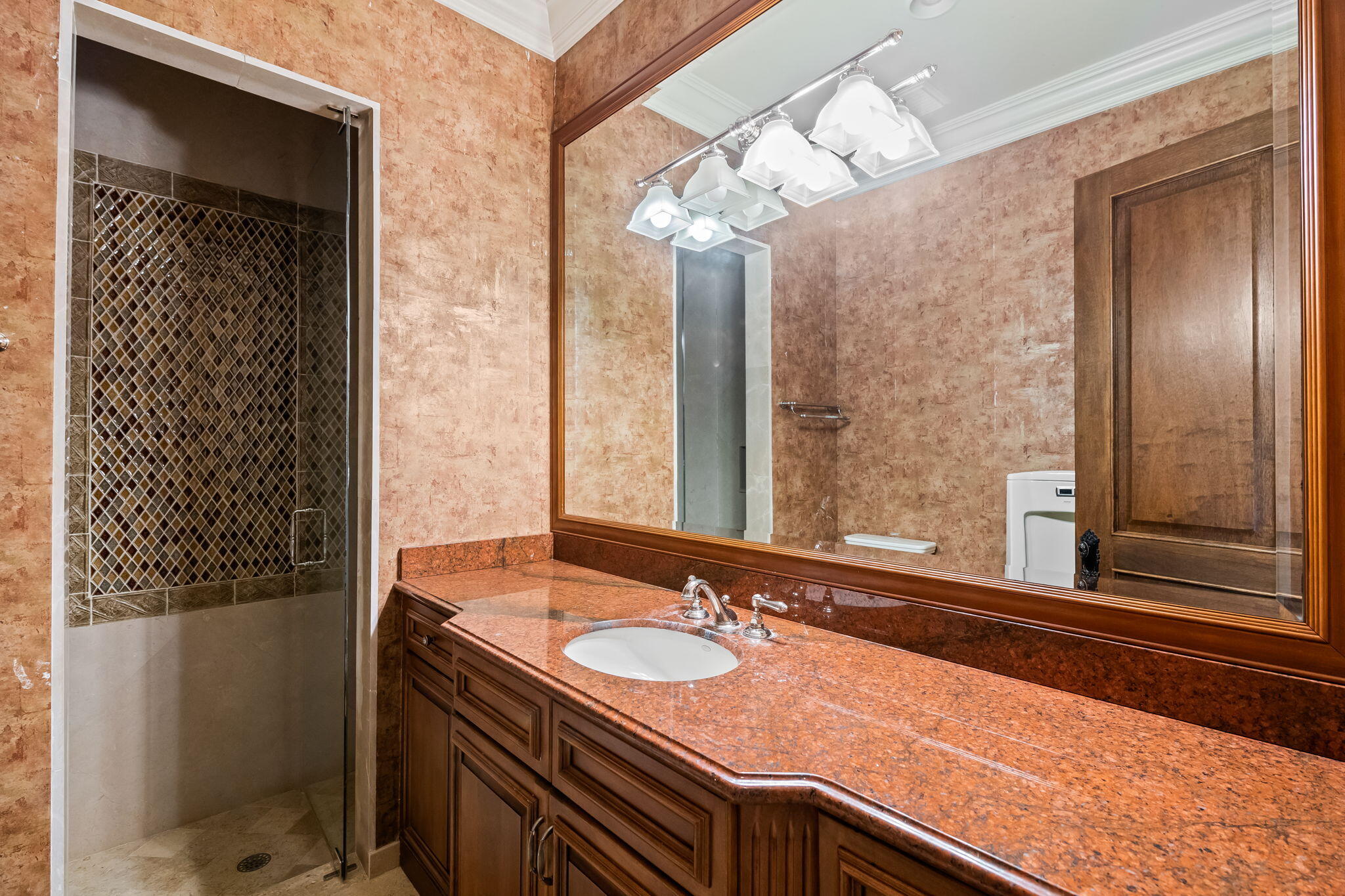 6300 Riverside Drive Parkland, FL 33067 - Photo 91 of 105 a bathroom with a granite countertop sink and a mirror