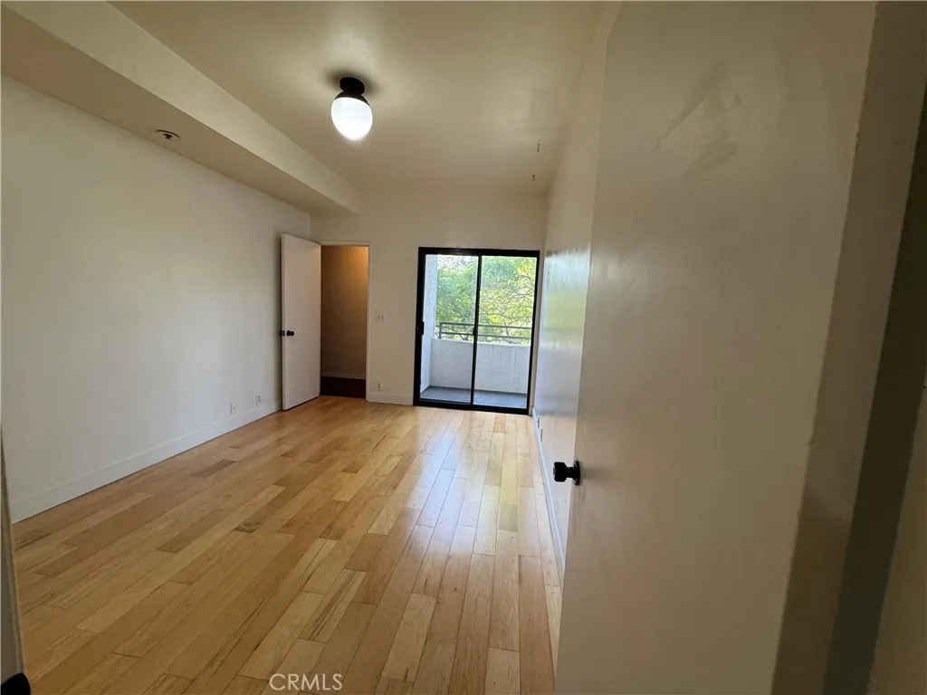 730 West 4th Street Long Beach, CA 90802 - Photo 13 of 35 wooden floor in an empty room with a window