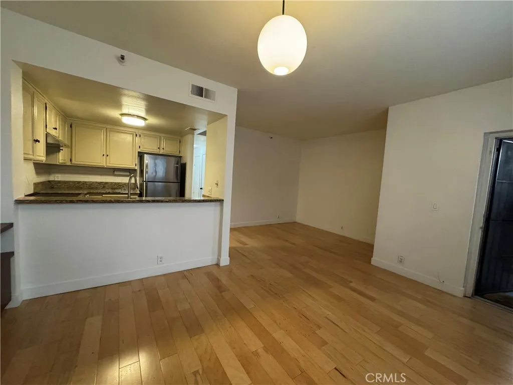 730 West 4th Street Long Beach, CA 90802 - Photo 18 of 35 a view of a room with wooden floor and staircase