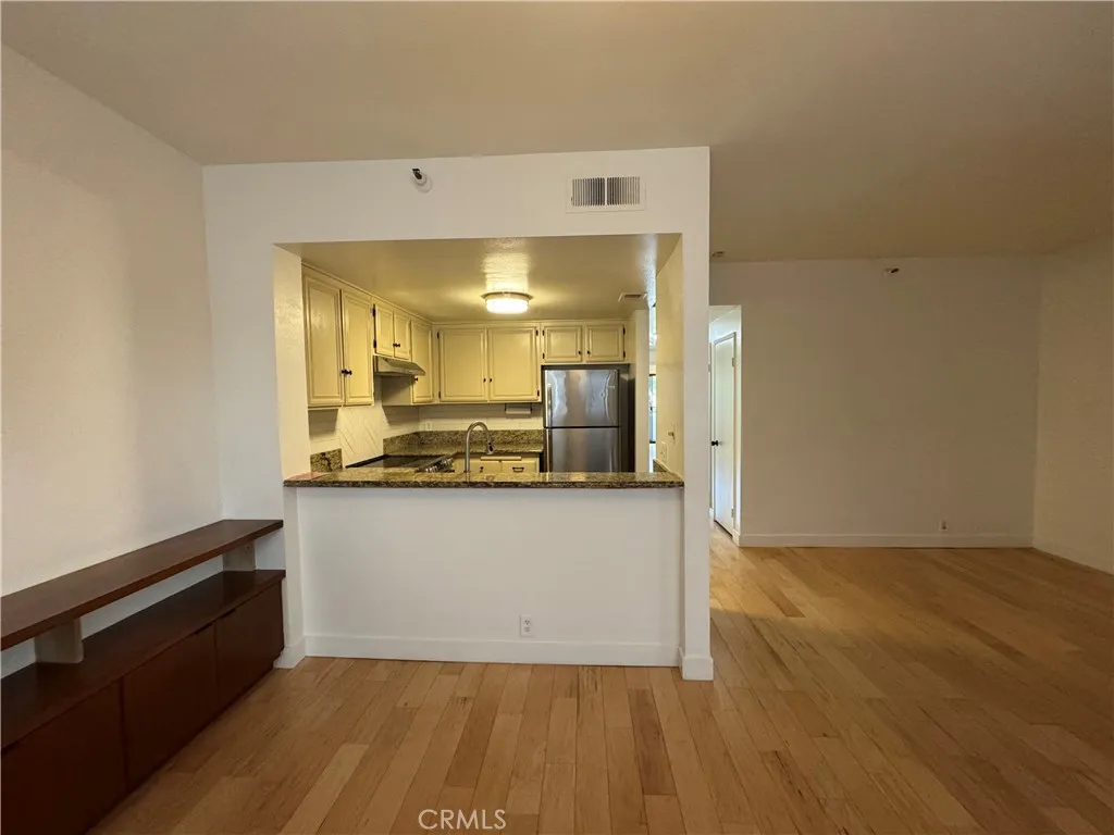 730 West 4th Street Long Beach, CA 90802 - Photo 20 of 35 a view of a kitchen cabinets and wooden floor