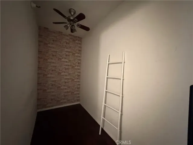 a view of entryway with a fan