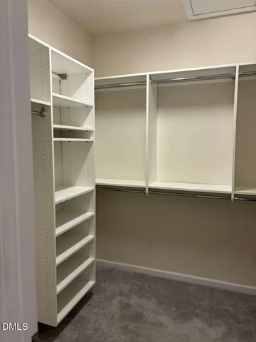 a view of an empty walk in closet