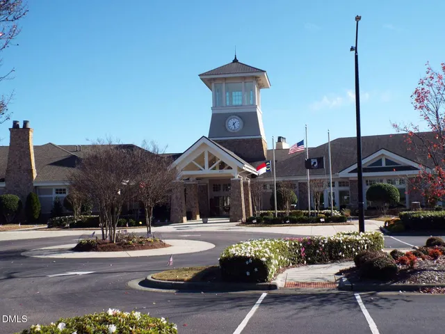 a view of a swimming pool with a patio and a garden