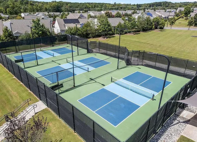 a building outdoor space with glass windows and outdoor seating