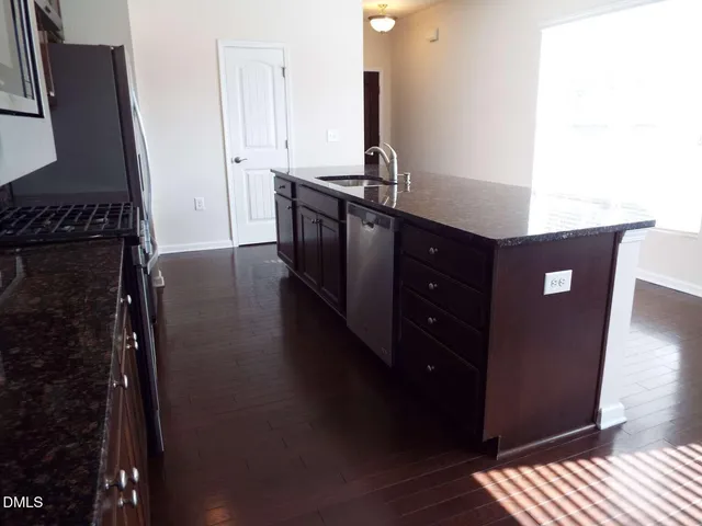 a view of a living room with furniture
