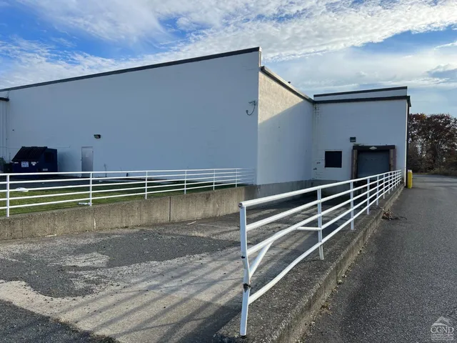 a view of a backyard with chairs