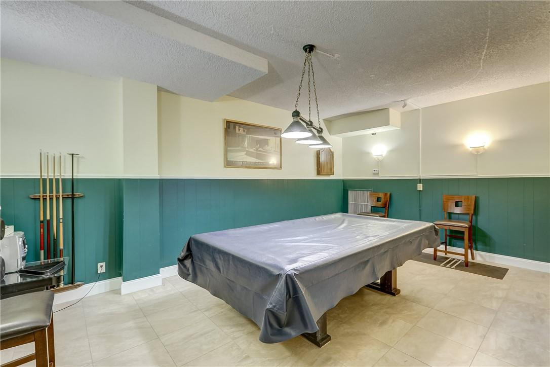 1505 North Riverside Drive, Unit 1208 Pompano Beach, FL 33062 - Photo 12 of 62 a room with pool table and wooden floor