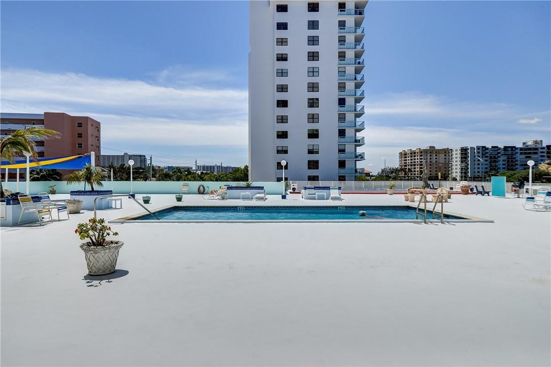 1505 North Riverside Drive, Unit 1208 Pompano Beach, FL 33062 - Photo 22 of 62 a view of swimming pool with outdoor seating and city view