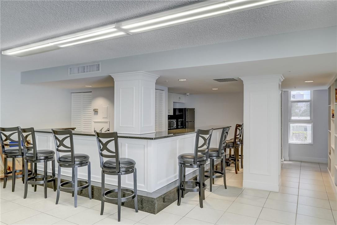 1505 North Riverside Drive, Unit 1208 Pompano Beach, FL 33062 - Photo 24 of 62 a view of a dining area with furniture
