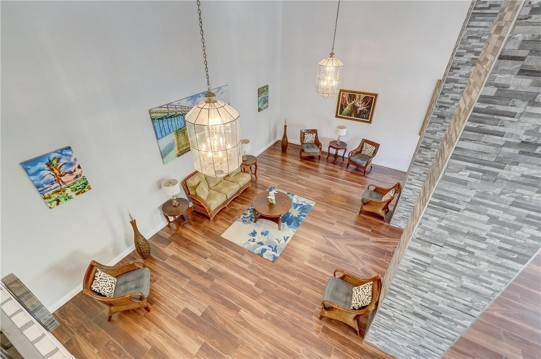 1505 North Riverside Drive, Unit 1208 Pompano Beach, FL 33062 - Photo 25 of 62 a living room with furniture and a wooden floor