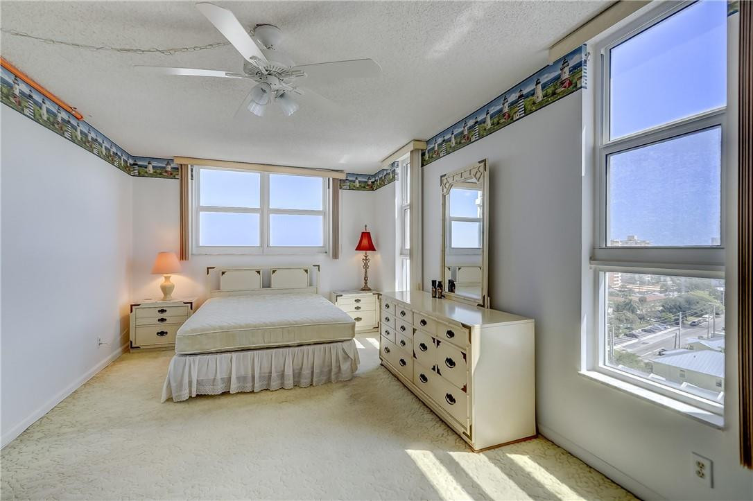 1505 North Riverside Drive, Unit 1208 Pompano Beach, FL 33062 - Photo 29 of 62 a bedroom with bed and window