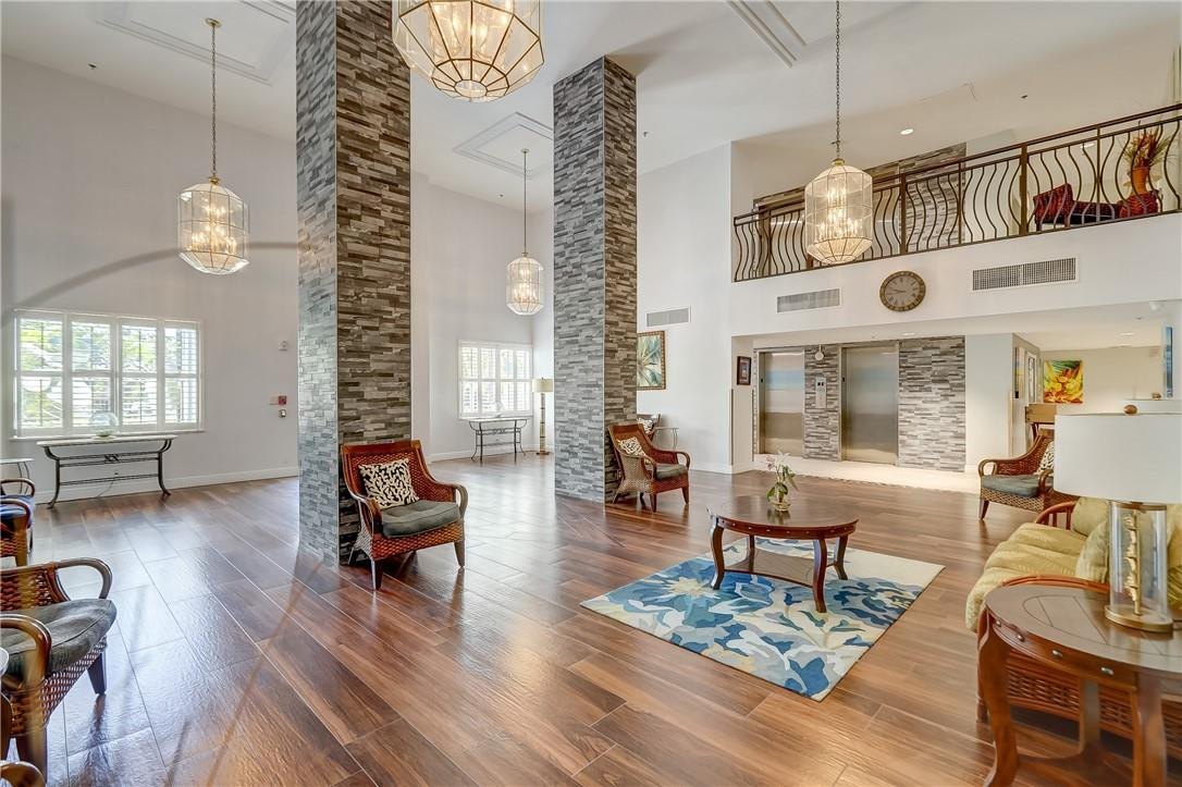 1505 North Riverside Drive, Unit 1208 Pompano Beach, FL 33062 - Photo 3 of 62 a living room with fireplace furniture and a large window