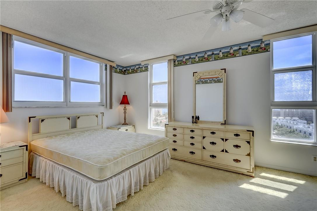 1505 North Riverside Drive, Unit 1208 Pompano Beach, FL 33062 - Photo 33 of 62 a spacious bedroom with a bed and a window