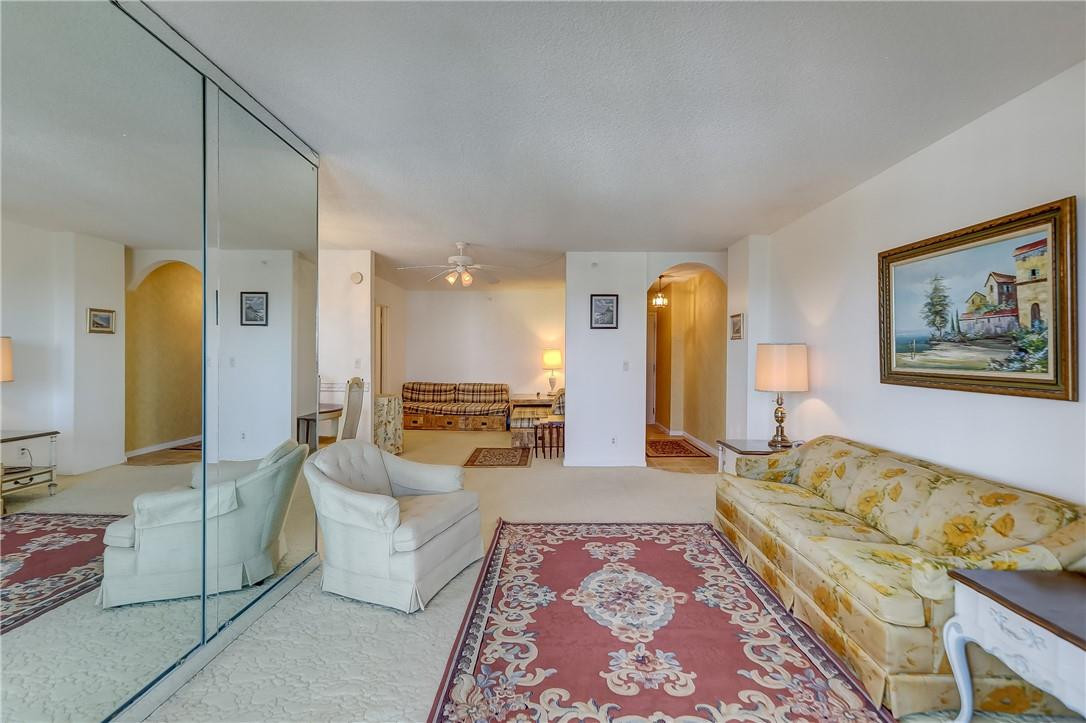 1505 North Riverside Drive, Unit 1208 Pompano Beach, FL 33062 - Photo 49 of 62 a living room with furniture and a fireplace