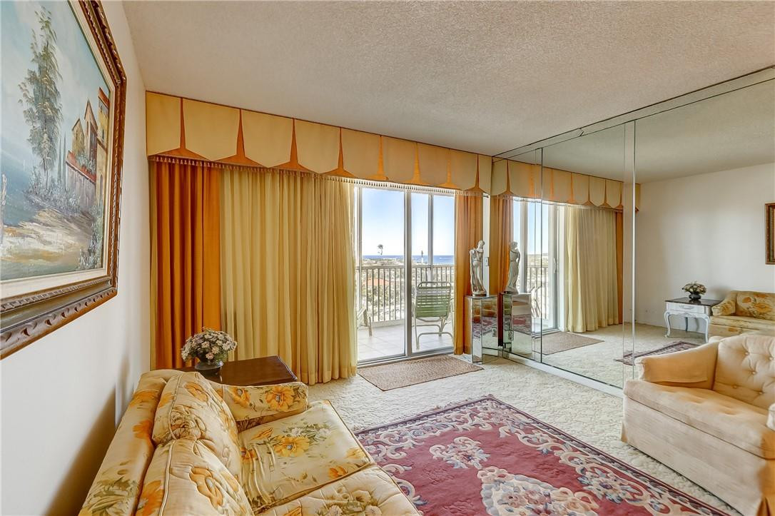 1505 North Riverside Drive, Unit 1208 Pompano Beach, FL 33062 - Photo 53 of 62 a spacious bedroom with a bed and a window