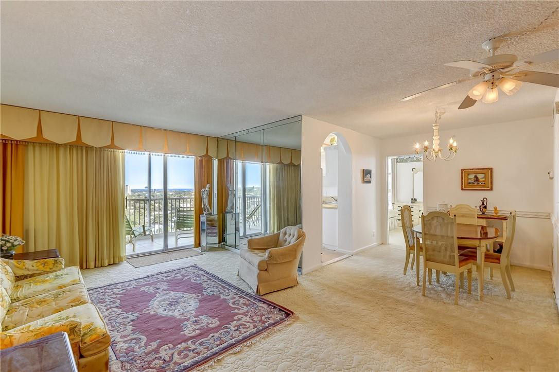 1505 North Riverside Drive, Unit 1208 Pompano Beach, FL 33062 - Photo 56 of 62 a living room with furniture and a large window