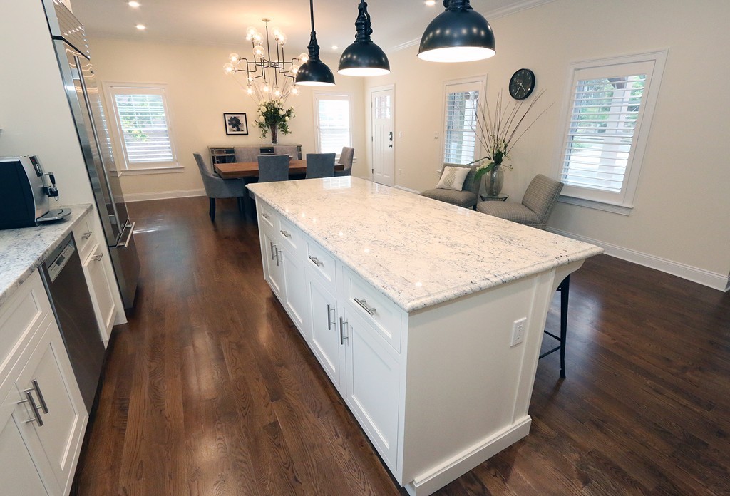 134 Salisbury Road, Unit 2 Brookline, MA 02445 - Photo 3 of 20 a large white kitchen with wooden floor