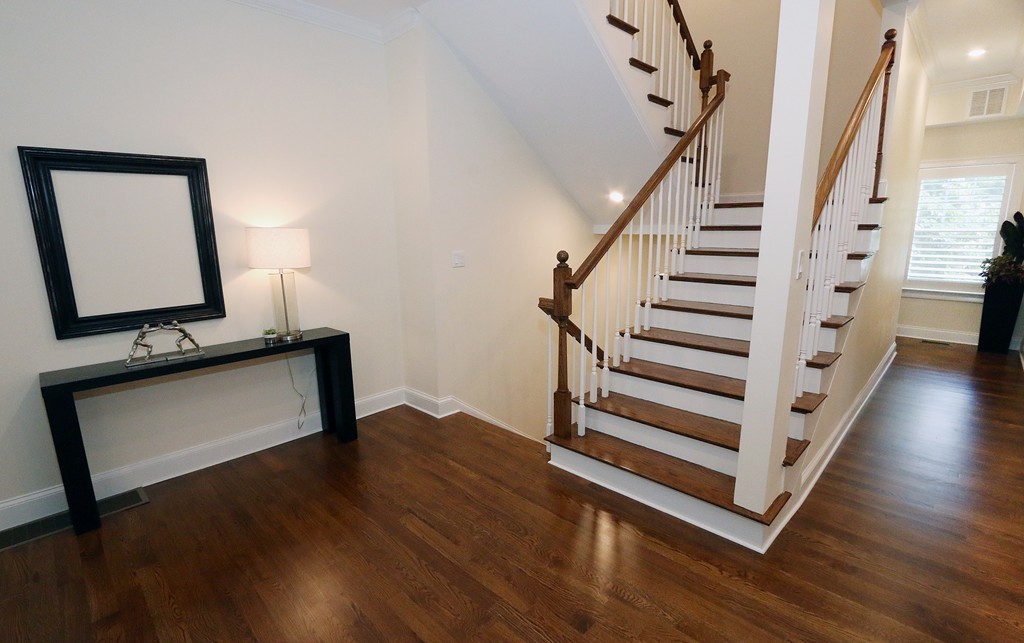 134 Salisbury Road, Unit 2 Brookline, MA 02445 - Photo 9 of 20 a view of a hallway with wooden floor and stairs
