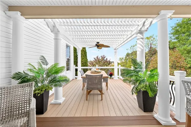 a view of balcony with furniture and potted plants