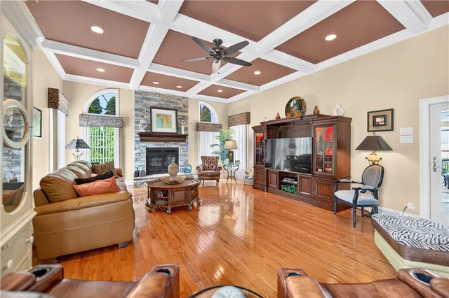 a living room with fireplace furniture and a flat screen tv
