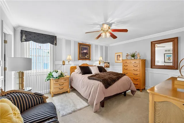 a bedroom with a bed couch and window